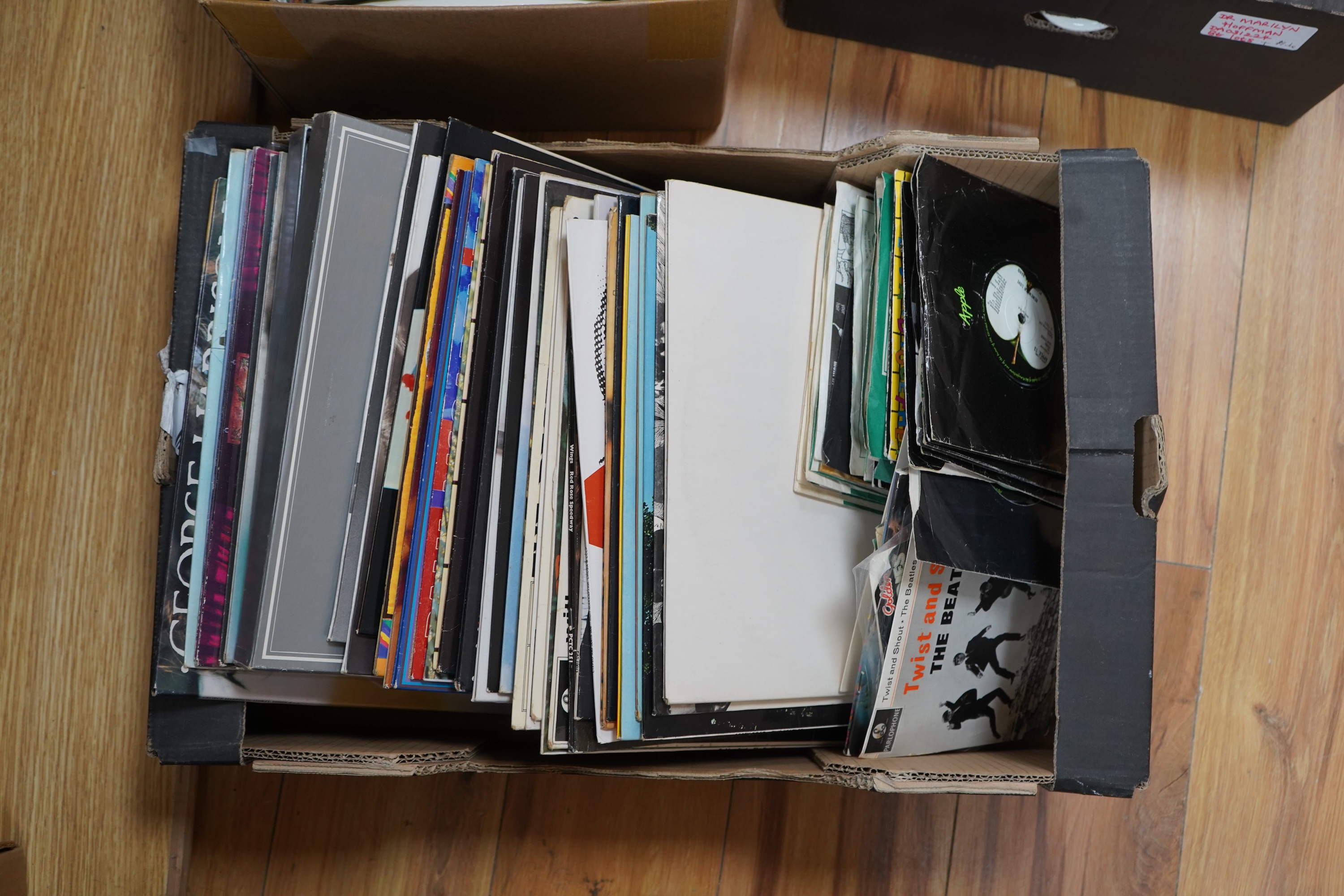 A collection of Beatles related LP's and singles, 36 LPs and a John Lennon box set, including; the ‘White Album’, a side loading issue, numbered 0111352, Revolver, Abbey Road, Sgt. Pepper, Let It Be, Beatles For Sale, Wi